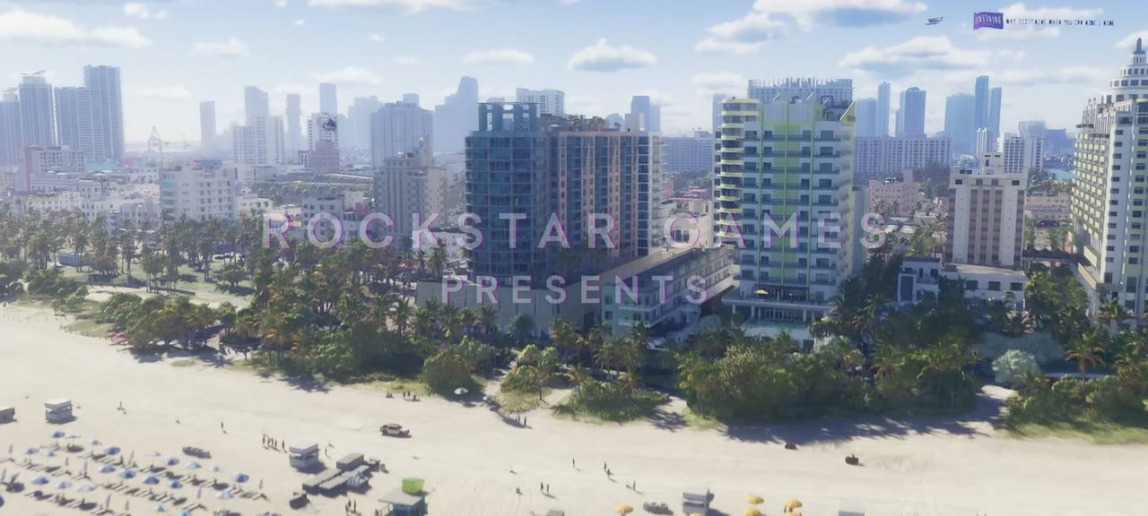 Aerial along a packed beach with the ROCKSTAR GAMES PRESENTS title over it.