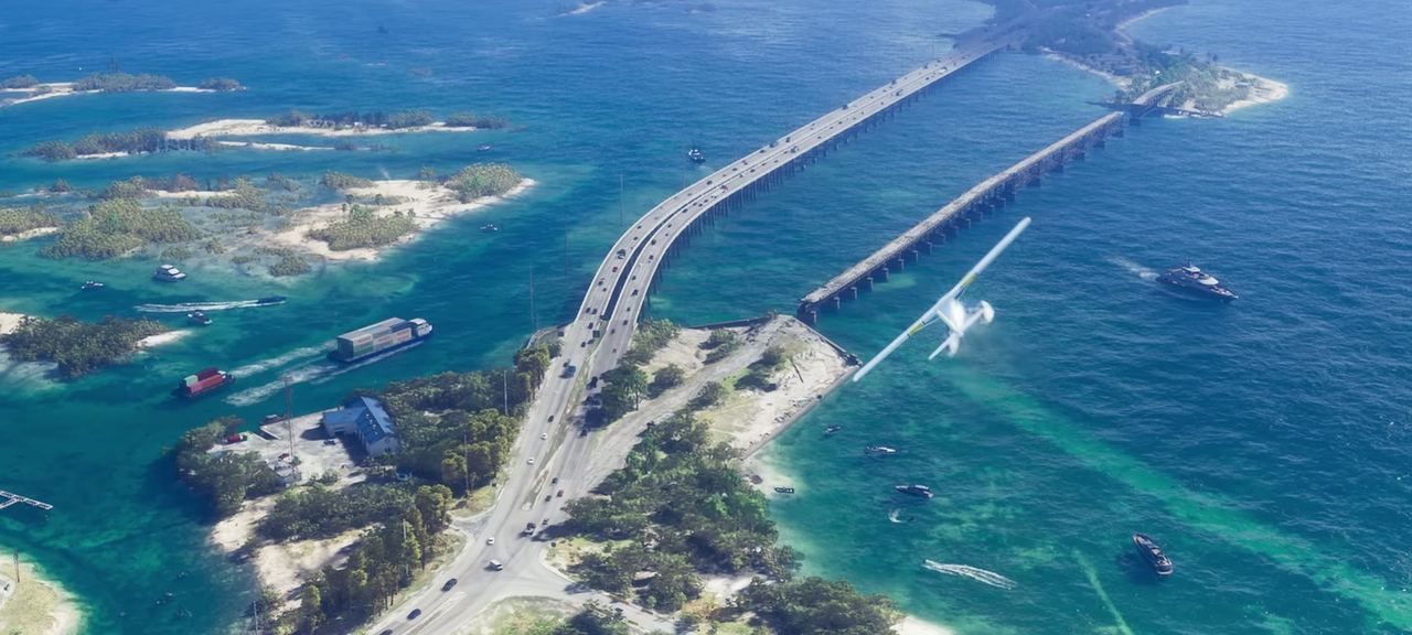 Aerial along a causeway running out over open water to the Keys.