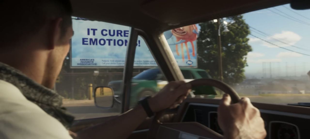 Driving point of view past a billboard reading IT CURE EMOTIONS.