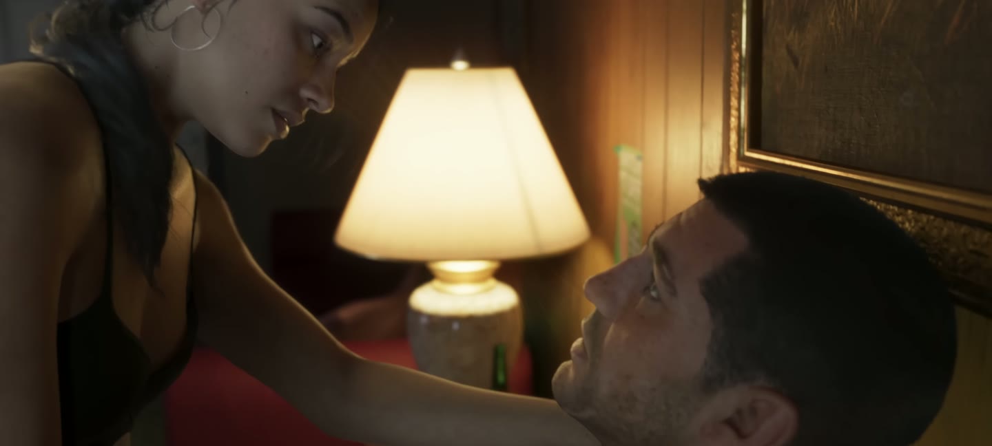 A bedroom, a lamp, two people. The trailer's last beat.