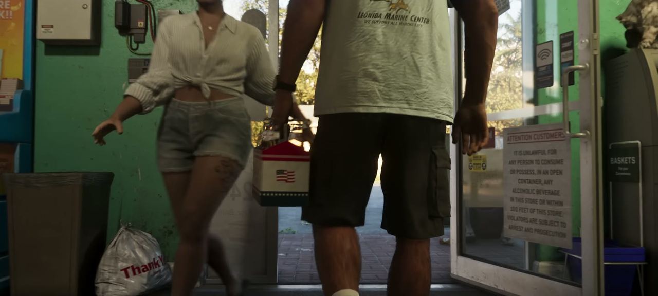 A shopfront with a couple stepping out, bags in hand.