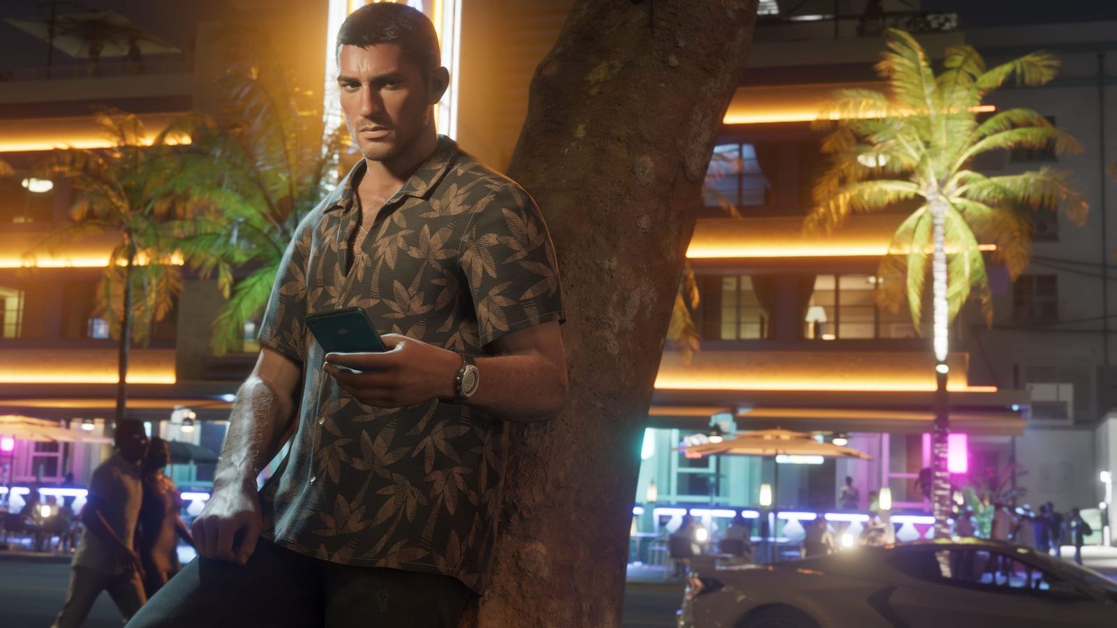 Jason on a phone at night outside a lit Vice City building