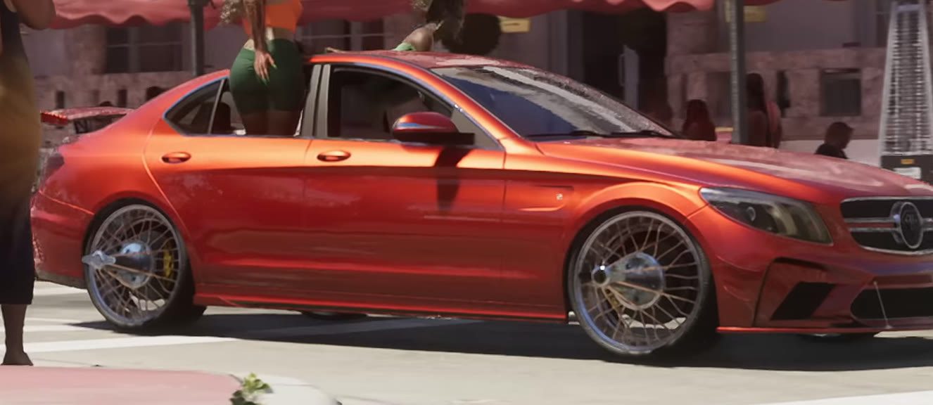 A red luxury sedan on wire wheels parked outside the Dominion Hotel on Ocean Drive